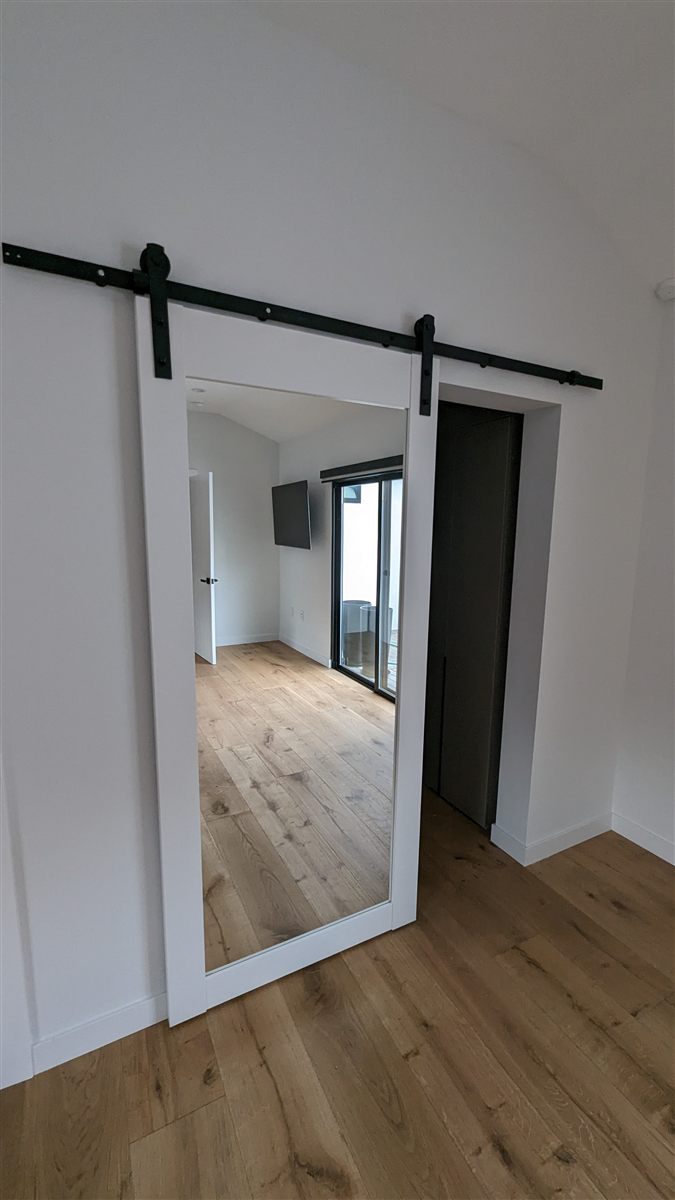 Mirrored barn door installation